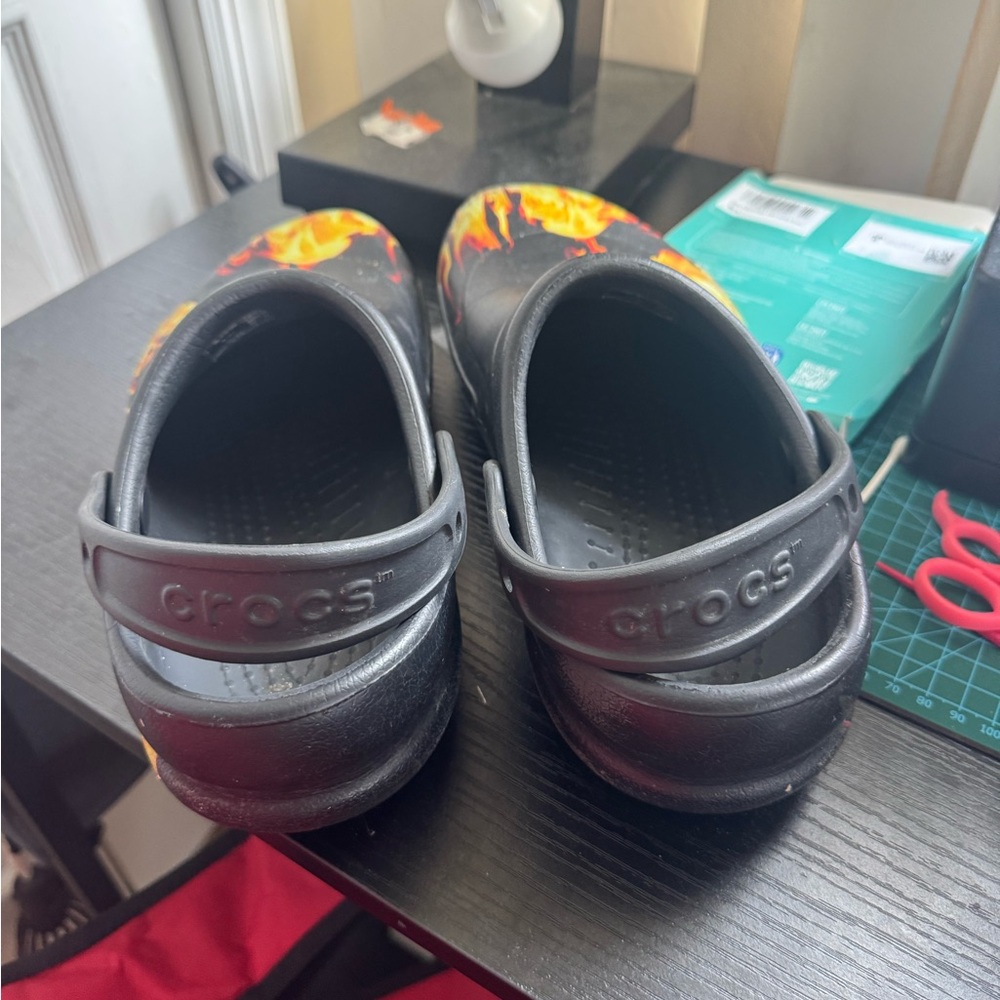 CROCS Black and Orange Slippers with Perforated Design